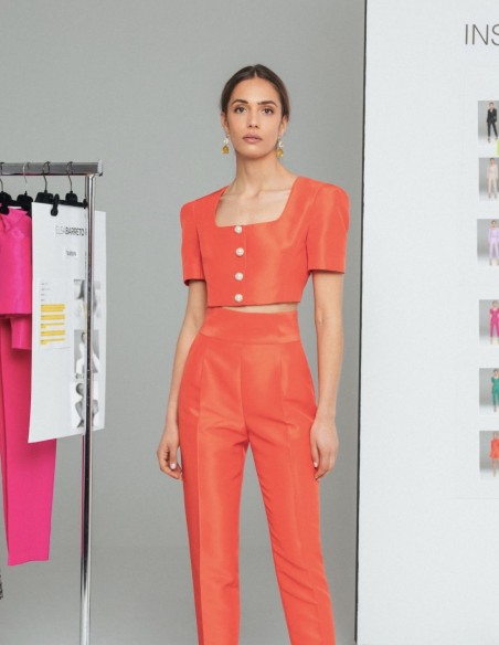 Orange long trousers with darts and pockets