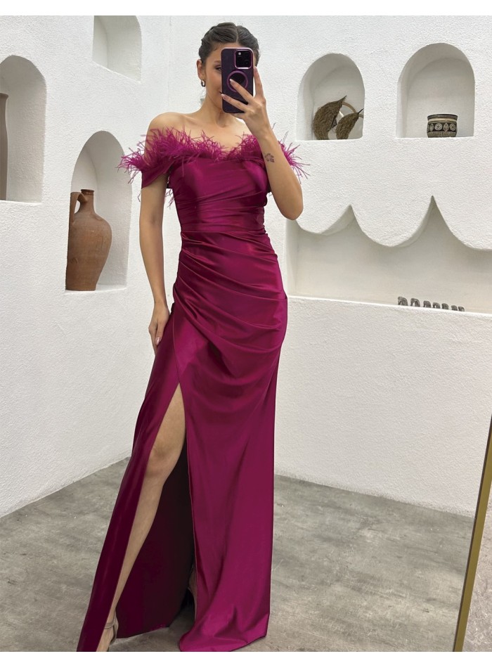 Evening dress with a feather bandeau neckline and side slit