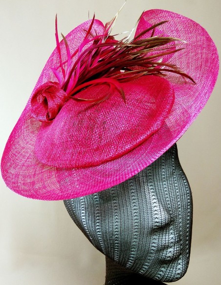 Raffia headdress with knot and goose feathers.