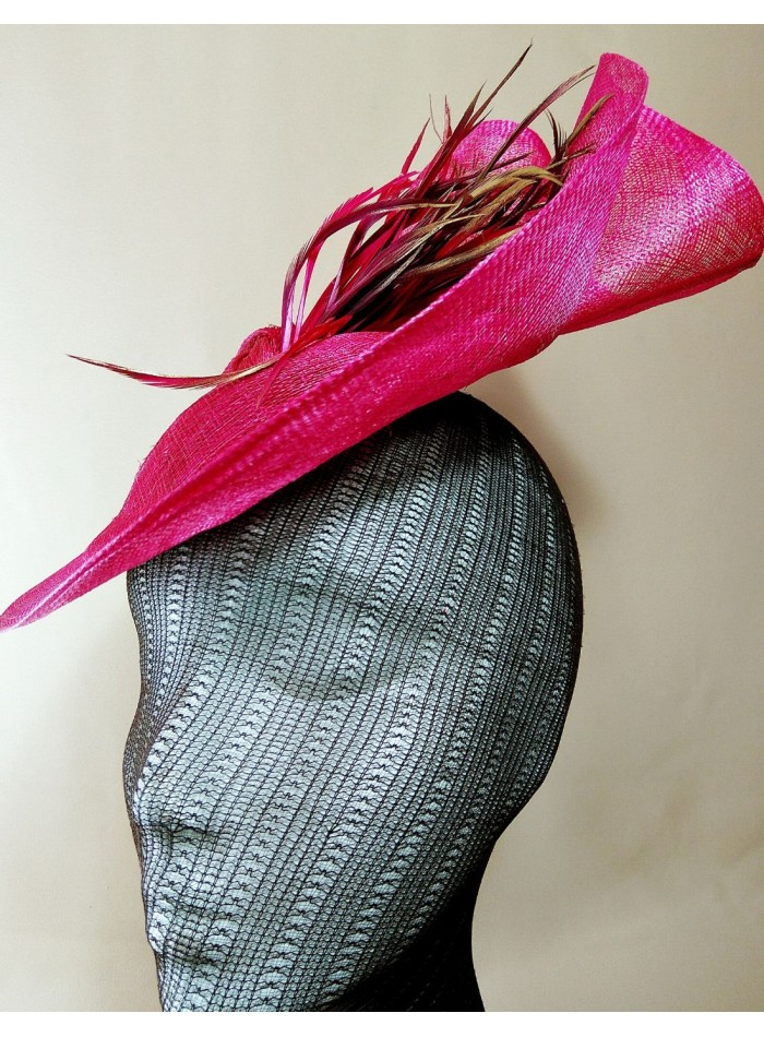 Fuchsia and brown raffia headdress with feathers.
