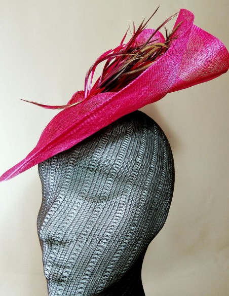 Fuchsia and brown raffia headdress with feathers.