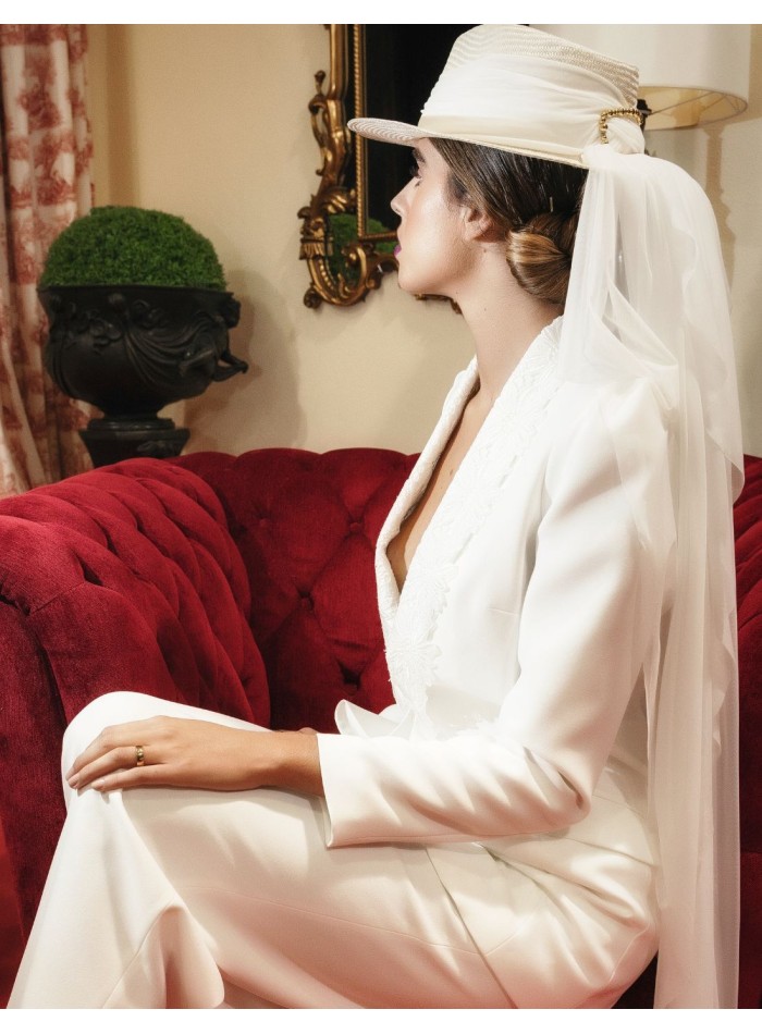 White bridal hat with long veil.