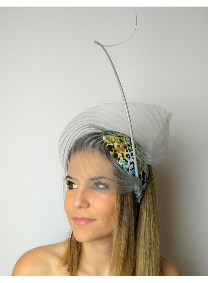 Guest headdress with gray pleated base made with animal print fabric.