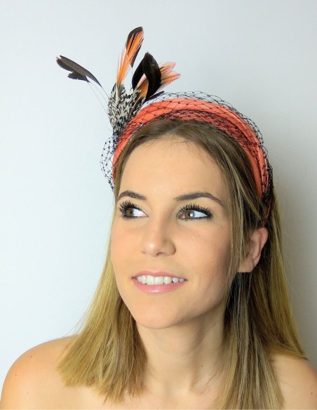 Orange headband with mesh overlay and feathers. Orange headband with mesh overlay and feathers.