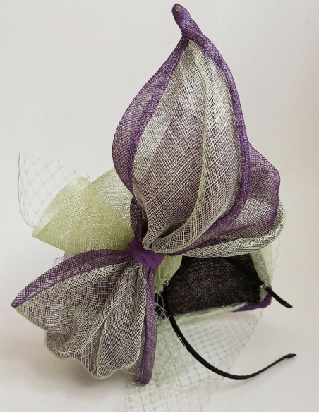 Purple and green headpiece for daytime events. Purple and green headpiece for daytime events.