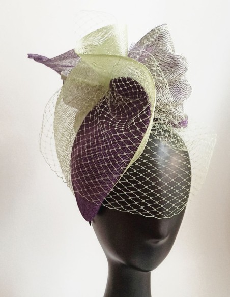 Guest headpiece in purple and green. Guest headpiece in purple and green.