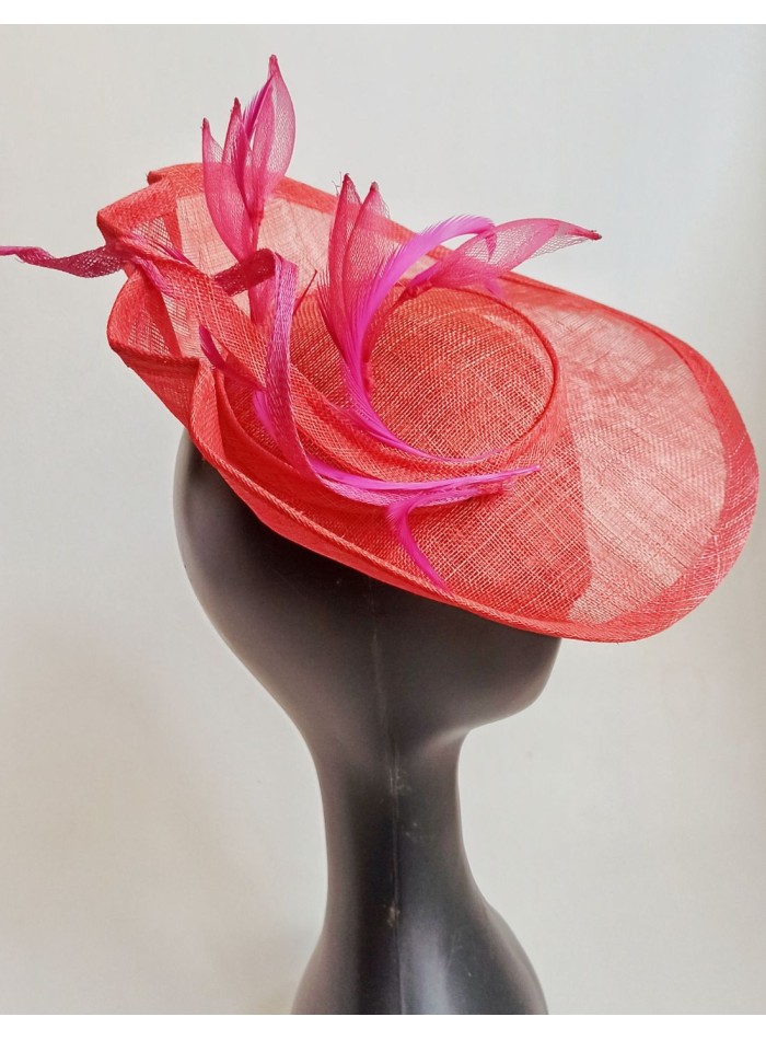 Feathered brim headpiece with feathers and flowers in pink.