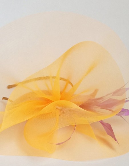 Orange headdress with feathers for guests.