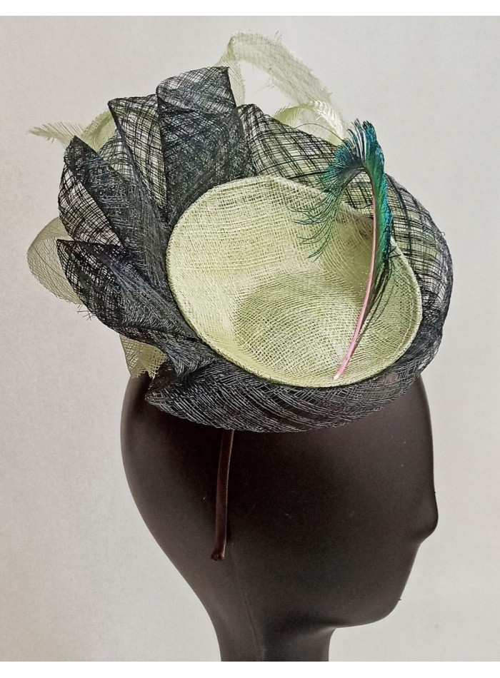 Riffle headpiece with peacock feather.