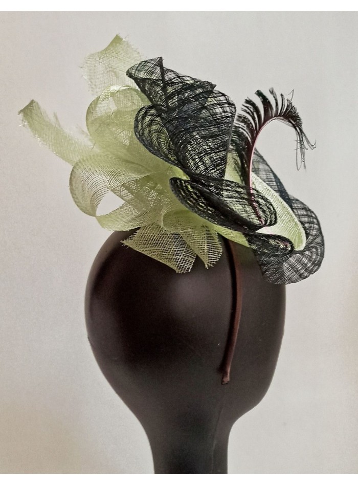 Raffia headdress for guests with feathers.