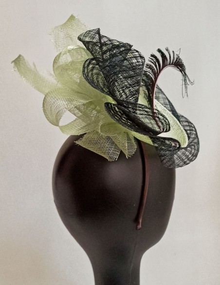 Raffia headdress for guests with feathers.