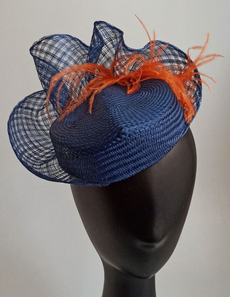 Handmade curved headdress with orange feathers. Handmade curved headdress with orange feathers.