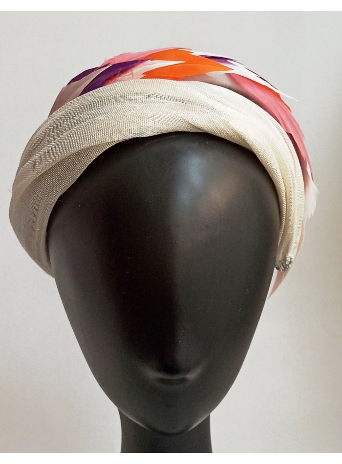 Sinamay and colored feathers guest headband.