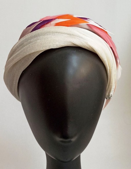 Sinamay and colored feathers guest headband.
