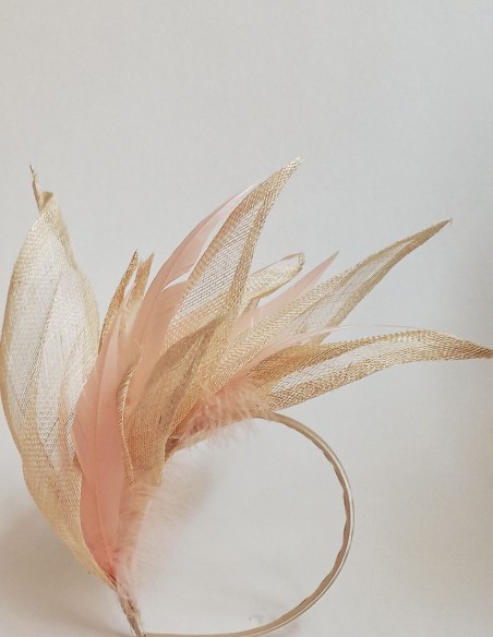 Intertwined raffia leaves and feathers headpiece. Intertwined raffia leaves and feathers headpiece.