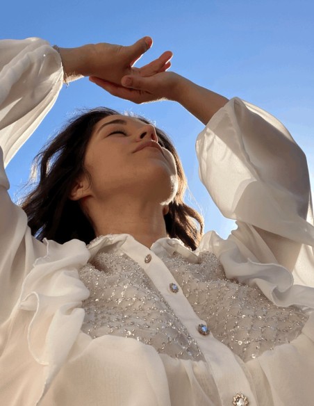 White party blouse with ruffles and crystals