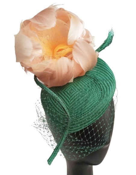 Green headdress with feather flower.