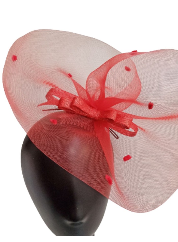 Red headdress with plumeti dots and bow.