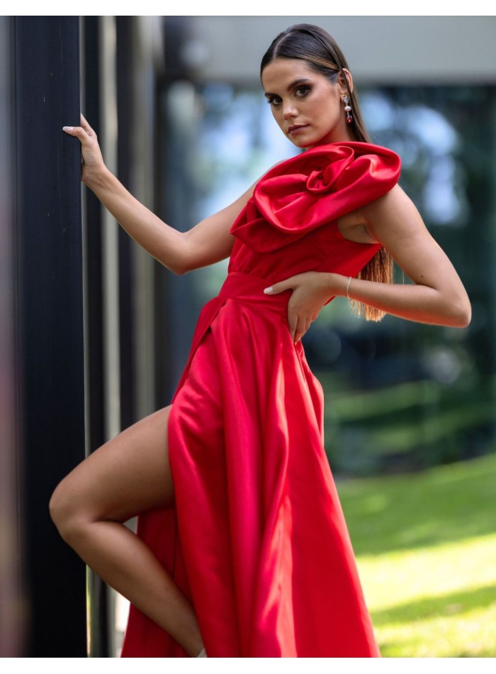 Long red party dress with asymmetric neckline and rosettes