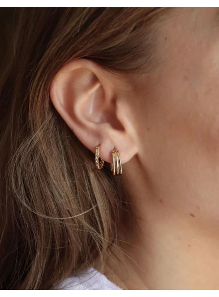 Triple golden earrings.