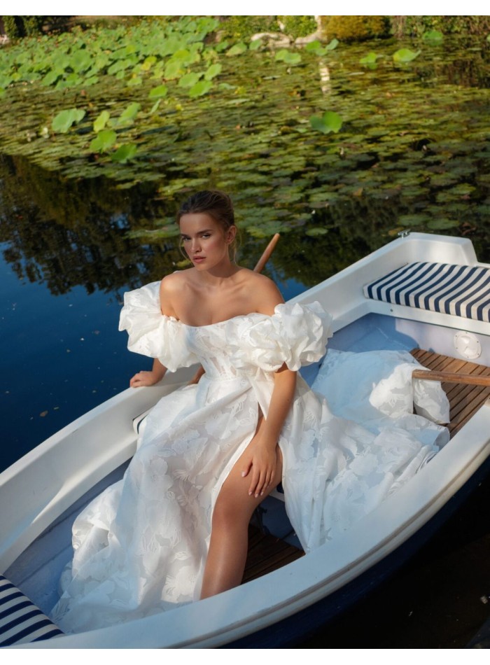 Ivory A-line wedding dress with a straight...