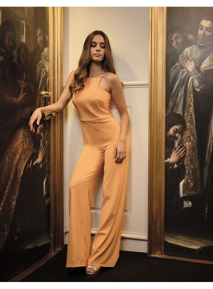 Orange long party jumpsuit with halter neckline and spaghetti straps