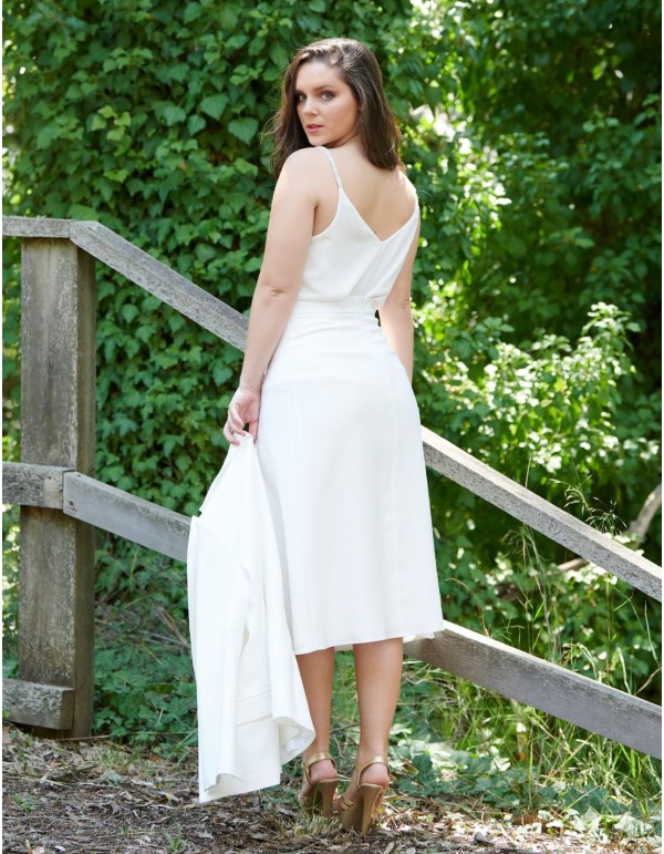 Falda midi blanca plisada. 2