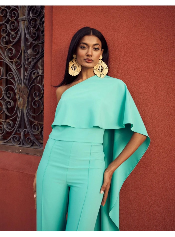 Asymmetric party top with asymmetric cape.