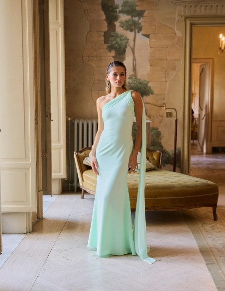 Long party dress with asymmetrical neckline and cape detail