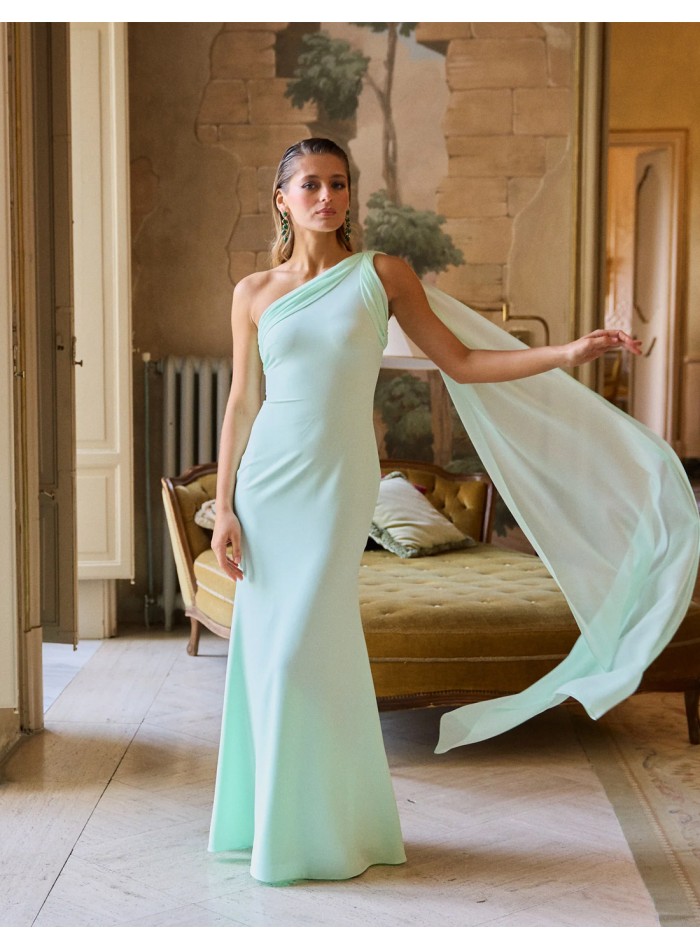 Long party dress with asymmetrical neckline and cape detail