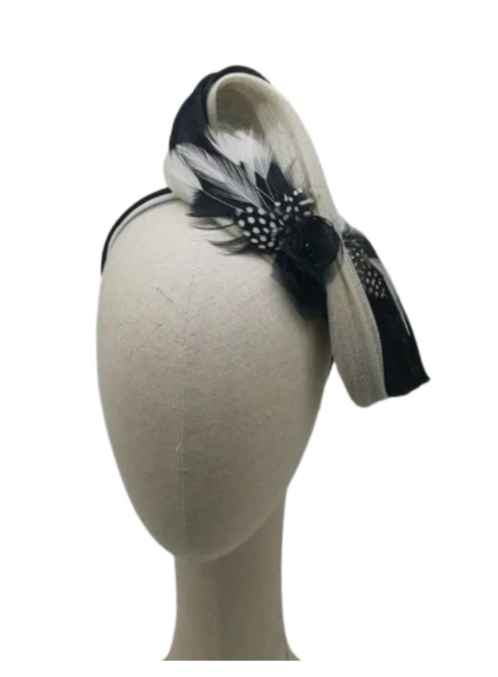 Black and white lace headdress with feather appliqués