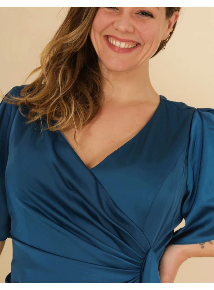 long satin gown with a V-neckline and flounce