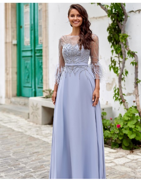 Long party dress with feather appliqués and rhinestones