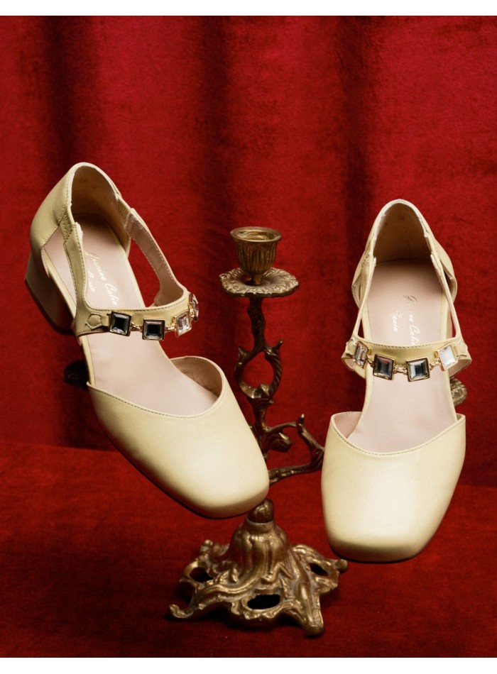Cream pumps with stone buckle embellishment