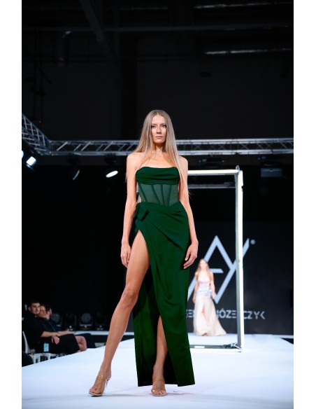 Emerald green evening dress with corset and high leg slit.
