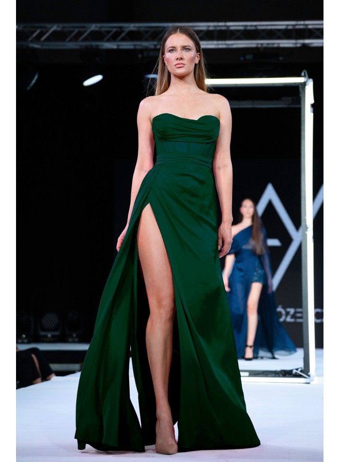 Long green evening dress with high neckline and high leg slit