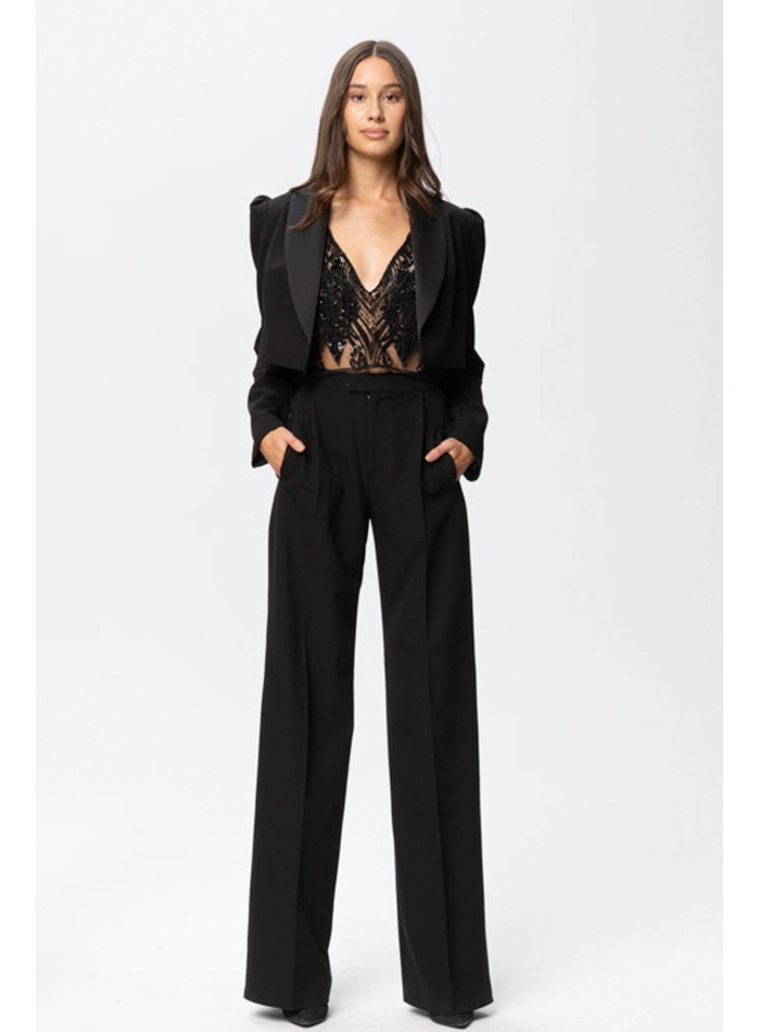 black cropped blazer with long sleeves and a...