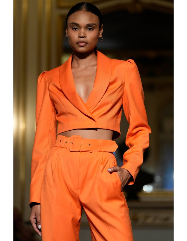 Short orange blazer with long, puffed sleeves