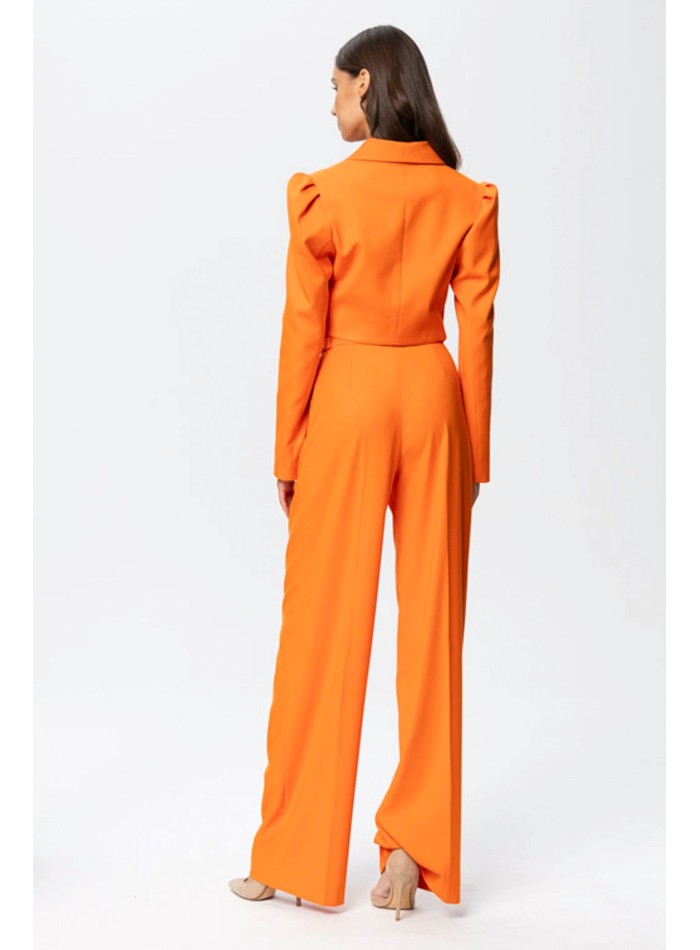 Short orange blazer with long, puffed sleeves