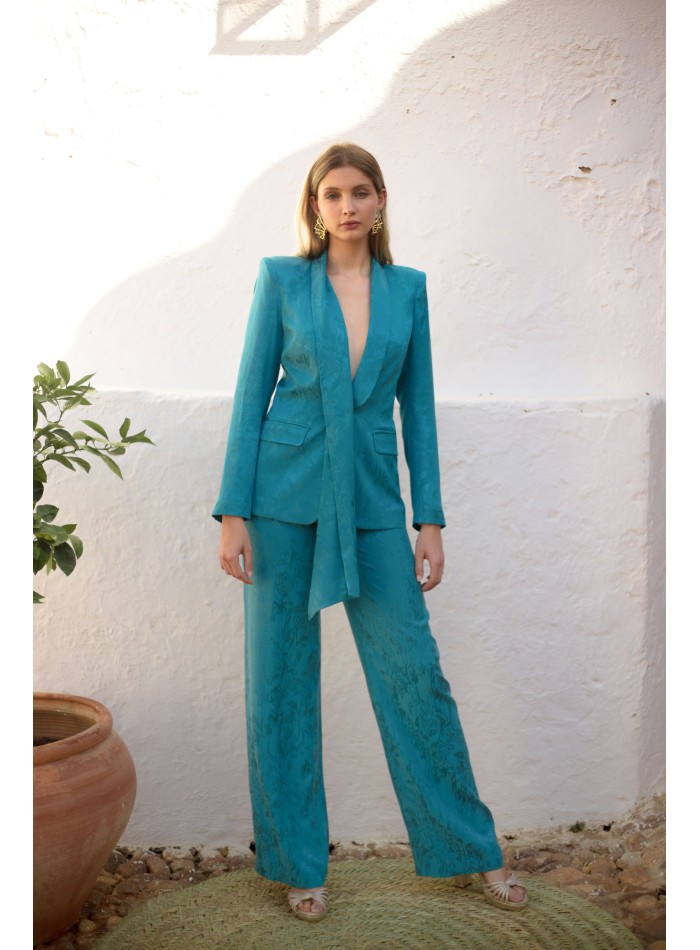 Tuxedo-collared suit and wide-legged pants