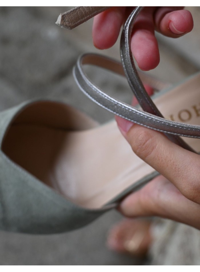 Green suede party shoe with silver details.