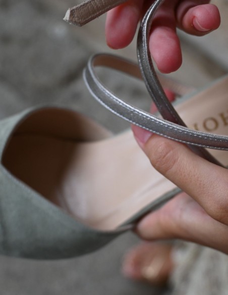 Green suede party shoe with silver details.