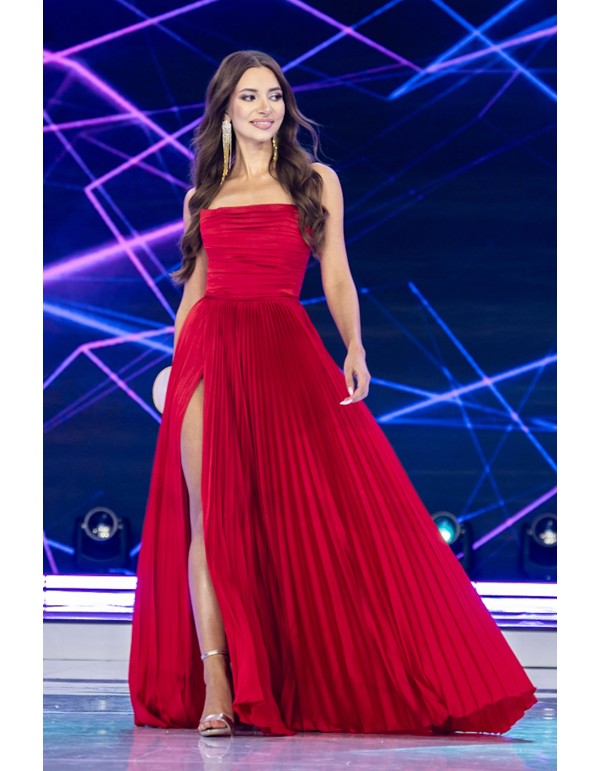 Evening dress with a pleated skirt and draped body
