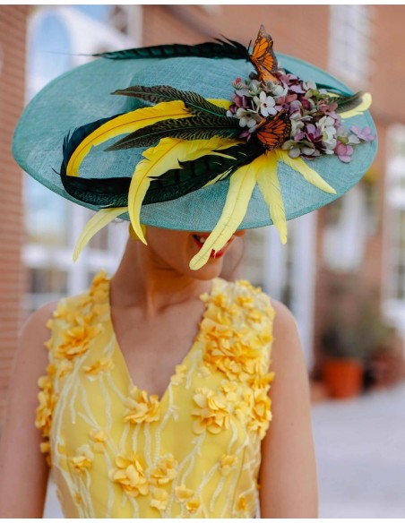 Handmade Pamela with yellow and green feathers, butterflies and Lamatte flowers.