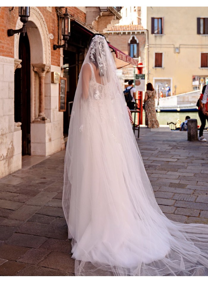 Ivory wedding dress with straps and floral...