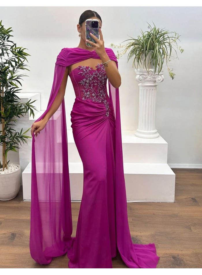 Evening dress with rhinestone neckline, draped detail and cape