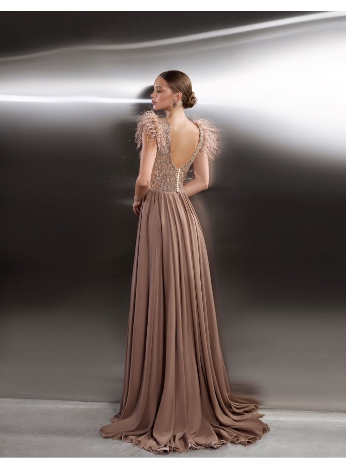 Long party dress with shimmering bodice and feathered shoulders